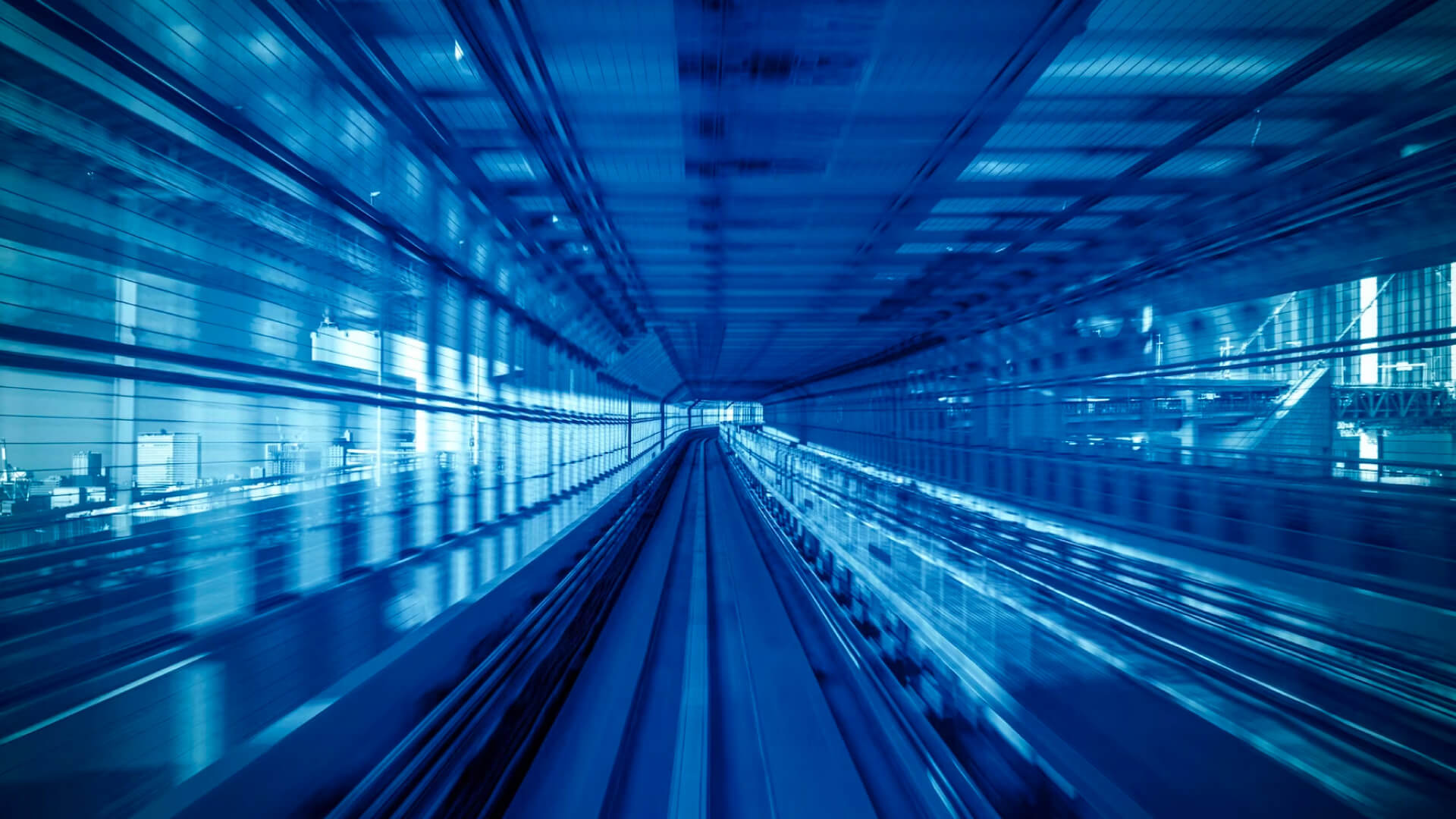 Train track tunnel in time-lapse with bluish tones